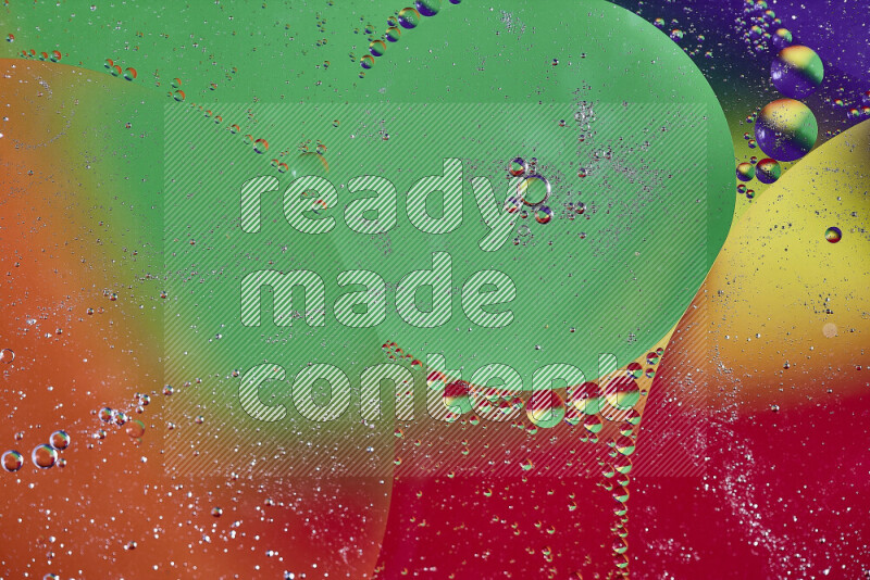 Close-ups of abstract oil bubbles on water surface in multicolors