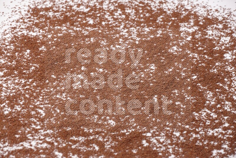 Garden cress seeds spread on a white flooring