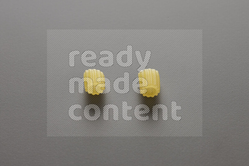 Small rings pasta on grey background
