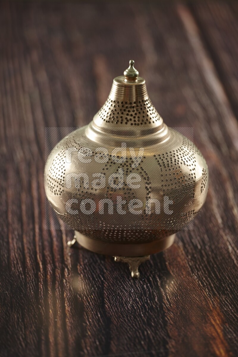 A lantern placed on a wooden background