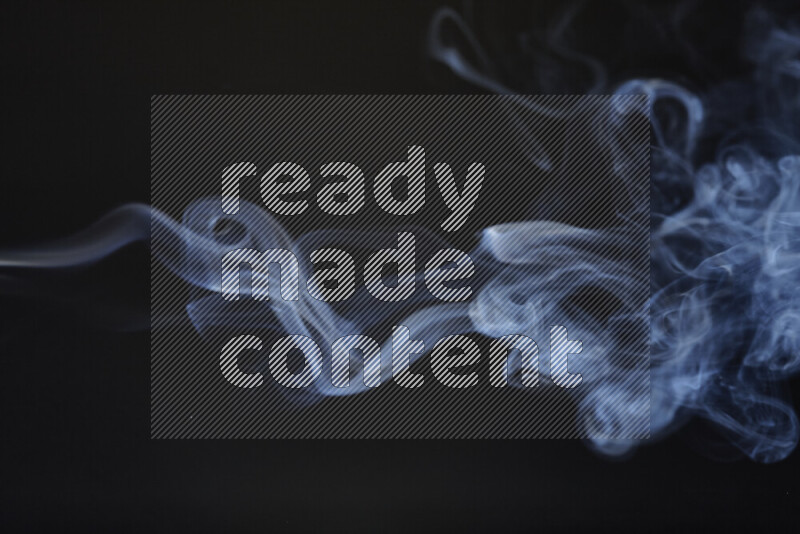 Motion of wavy smoke isolated on dark background
