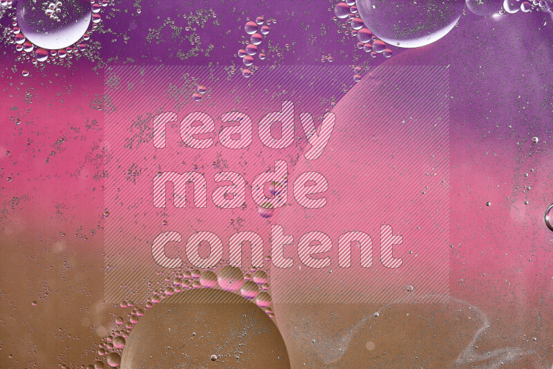 Close-ups of abstract oil bubbles on water surface in shades of brown, purple and pink