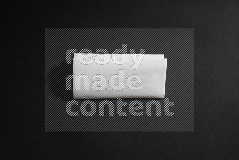 White paper sheet on black background
