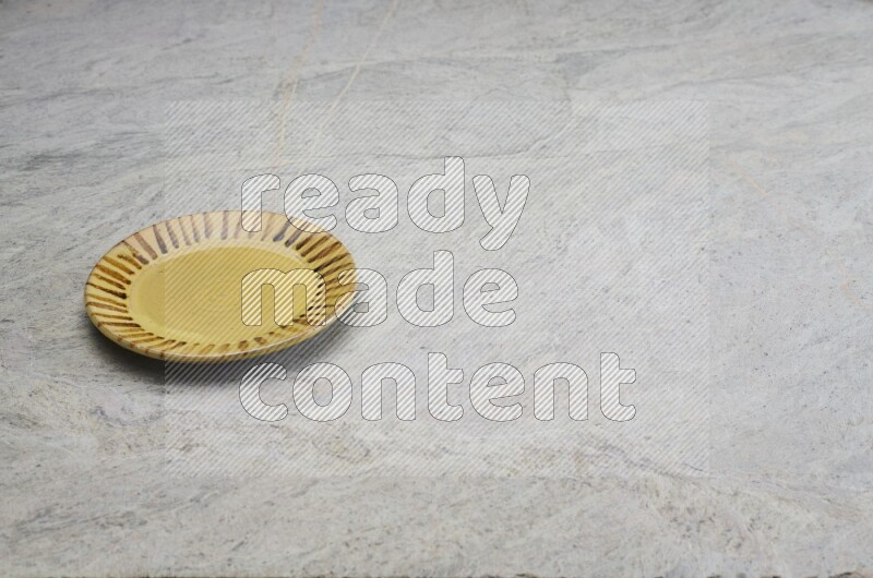 Multicolored Pottery Plate On Grey Marble Flooring