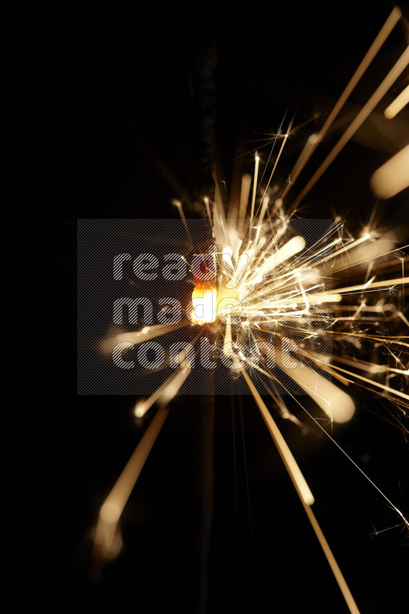 A close-up image of sparkler candle isolated on black background