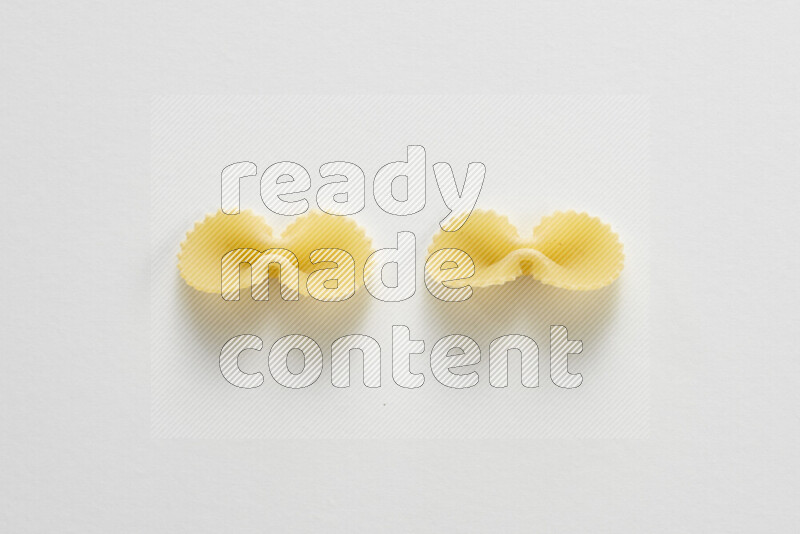 Fiocchi pasta on white background