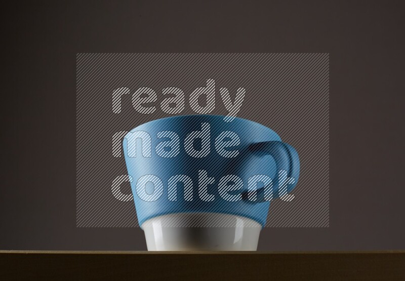 Low angle shot of a bicolor cup on grey background