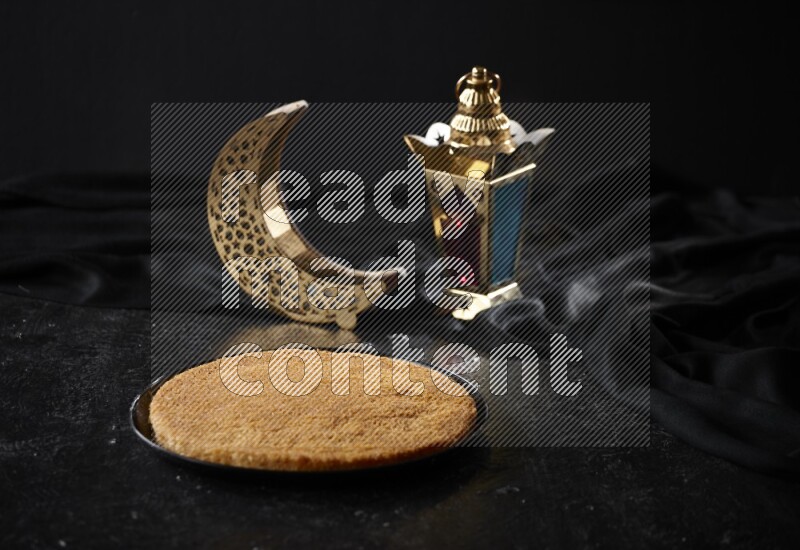 Konafa with lanterns in a dark setup