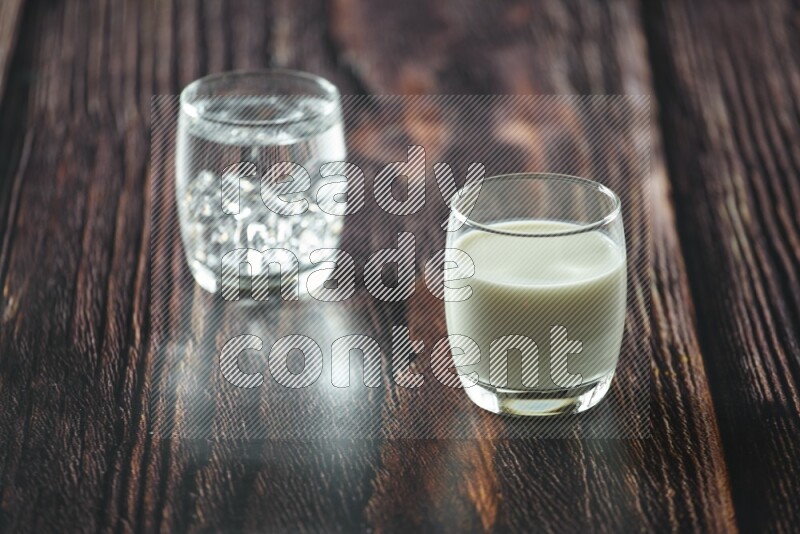Cold drinks in a glass cup such as water, tamarind, qamar eldin, sobia, milk and hibiscus on wooden background