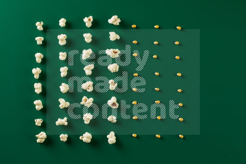 Popcorn flakes and seeds on a green background in a top view shot