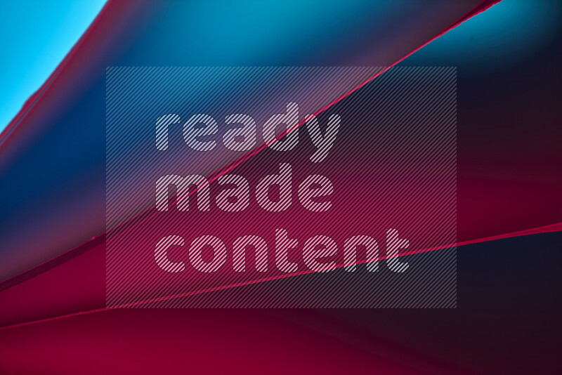 An abstract art piece displaying smooth curves in warm and cold gradients created by colored light