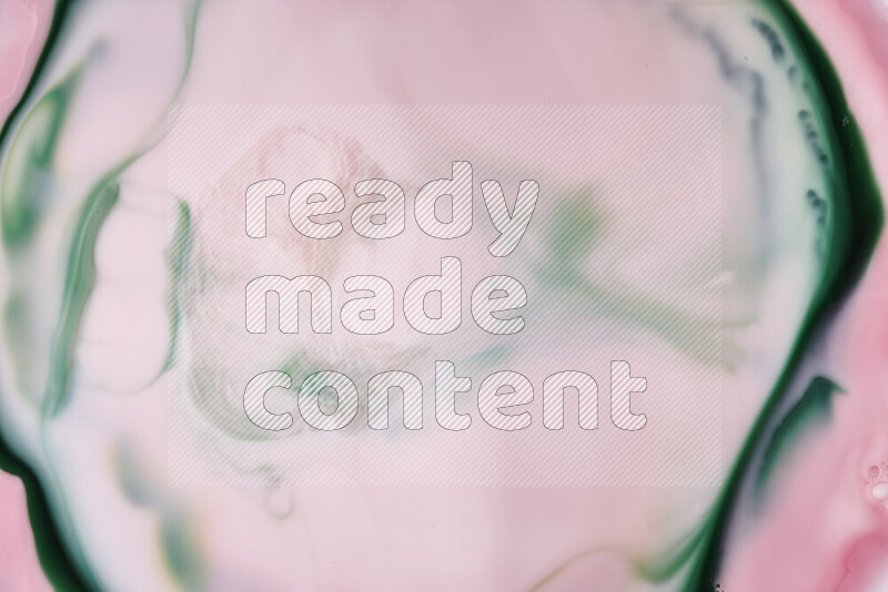 A close-up of abstract swirling patterns in red and green