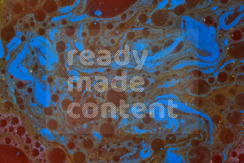 The image depicts a marbling effect with swirling patterns of red, blue and yellow