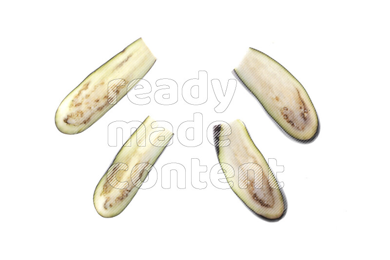 Eggplant slices on illuminated white background
