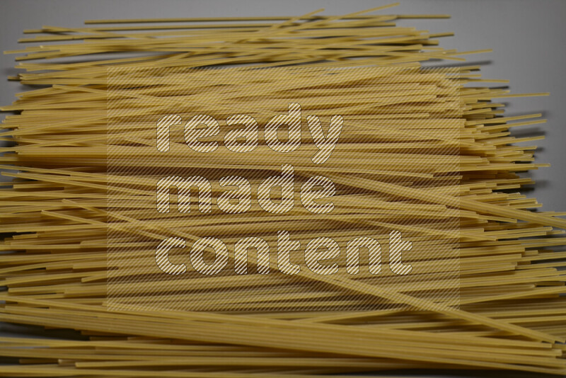 Spaghetti pasta on grey background