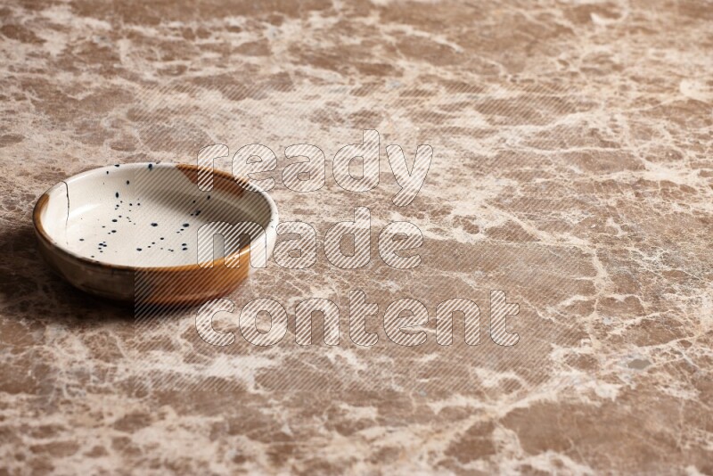 Multicolored Pottery Bowl on Beige Marble Flooring