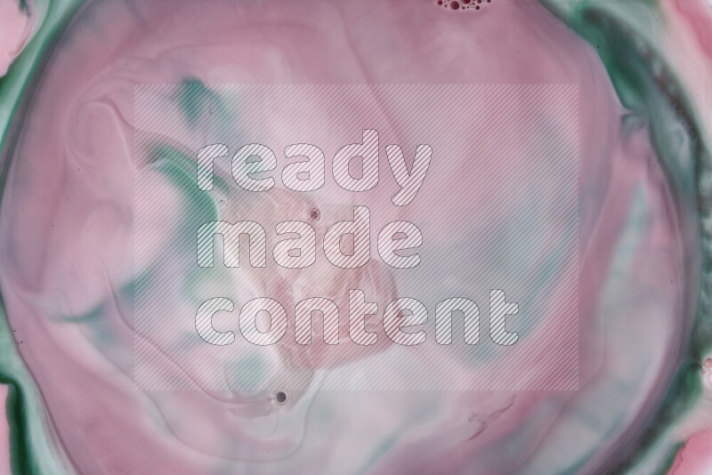 A close-up of abstract swirling patterns in red and green