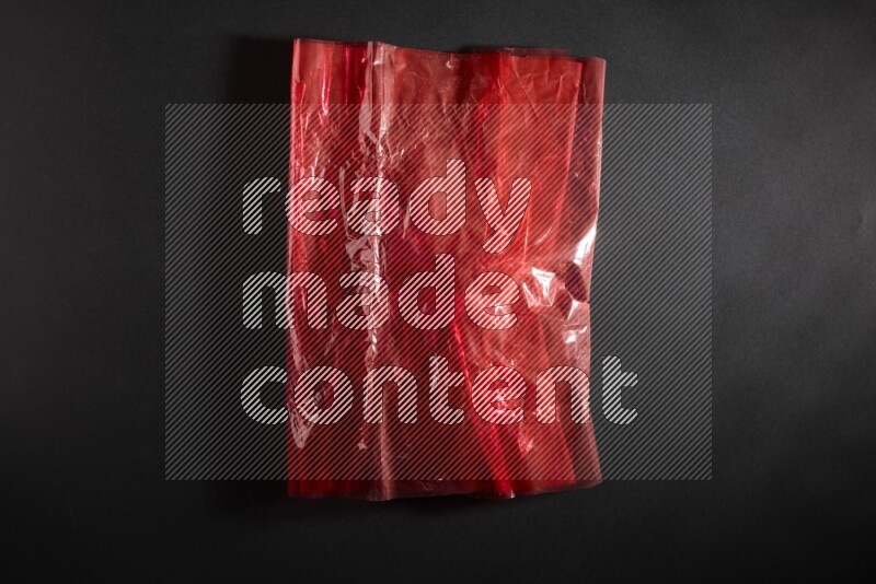 Colored plastic textures on black background