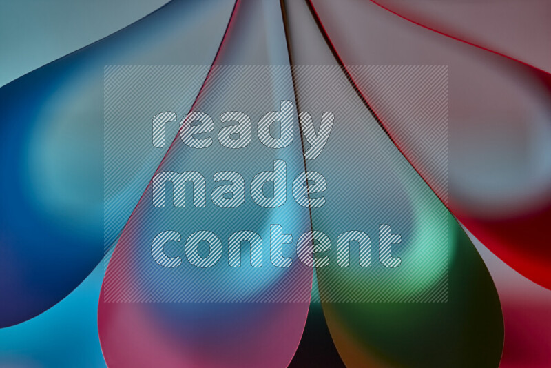 An abstract art piece displaying smooth curves in colorful gradients created by colored light