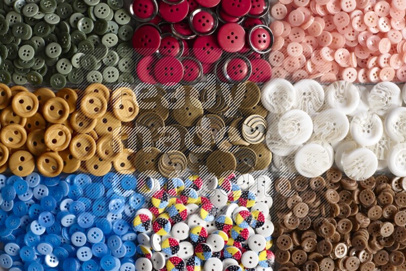 Multicolored buttons placed on grey background