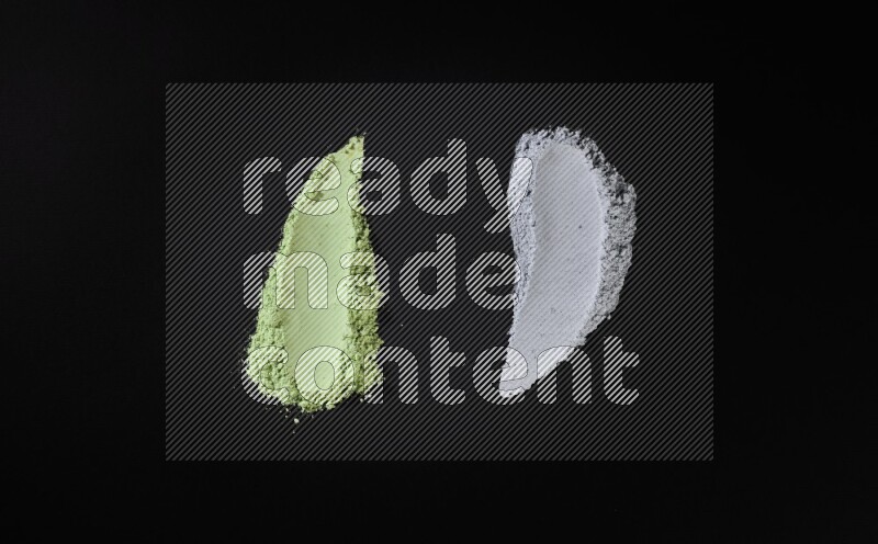 Multicolored powder smears on black background