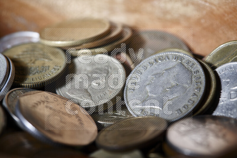 A close-ups of random old coins on black background