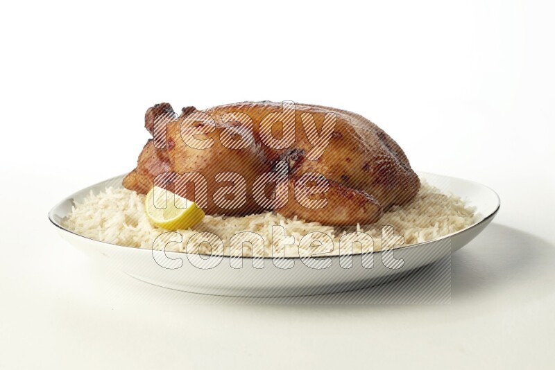 white  basmati Rice with  whole roasted chicken  on a white plate with a silver rim direct  on white background