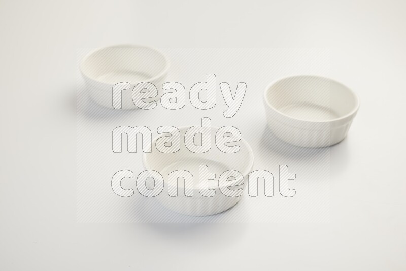 white ceramic round sauce dish on white countertop