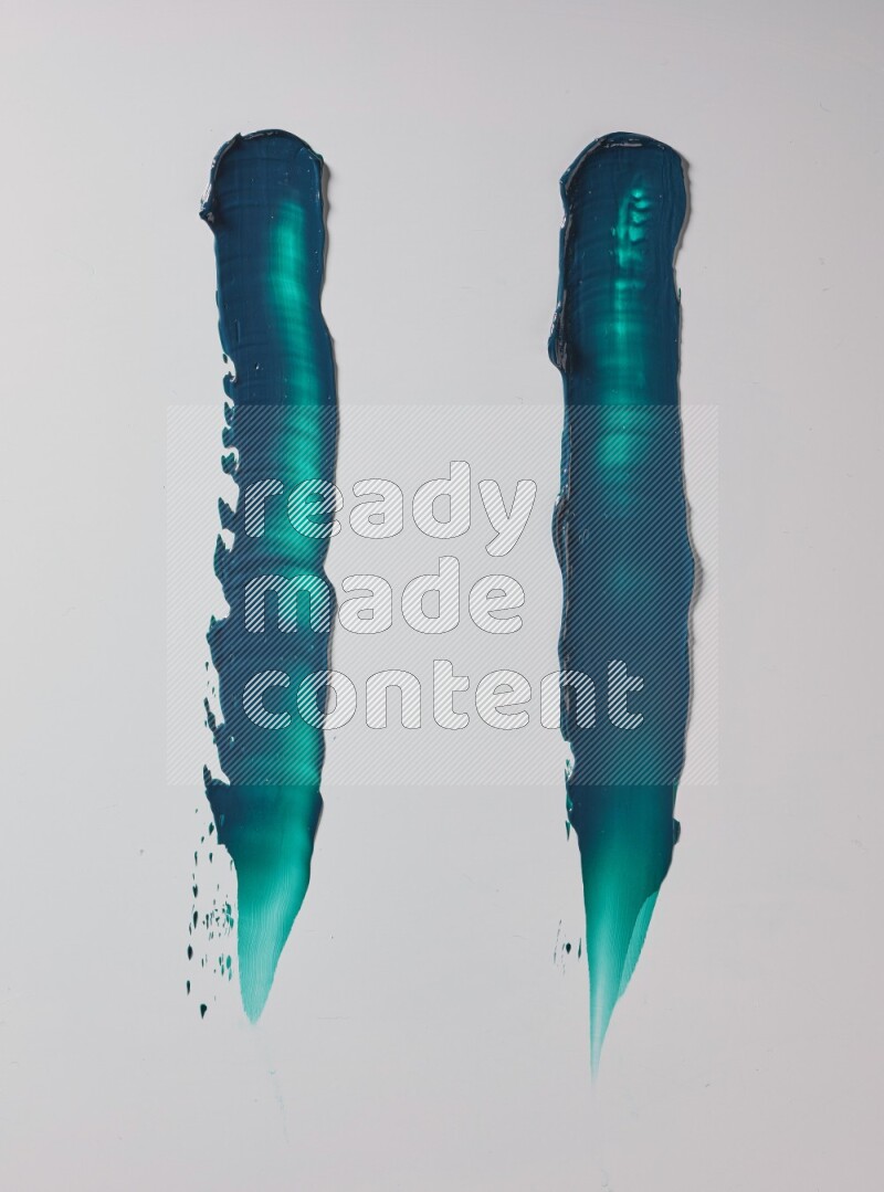 Turquoise painting knife strokes on white background