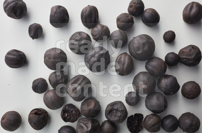 Top-view shot of dried lime (loomi) on white background