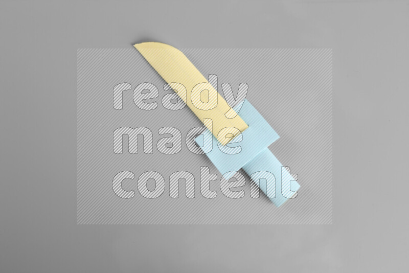 Origami sword on grey background
