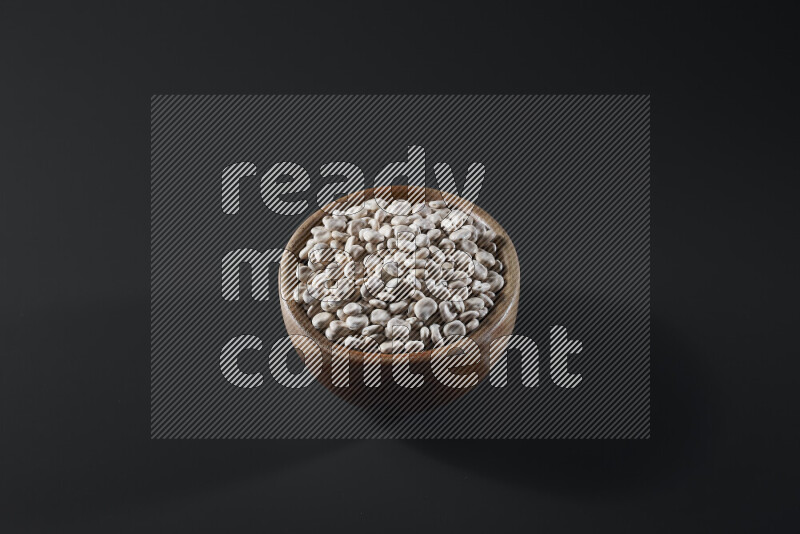 Lupin Beans in a wooden bowl on grey background