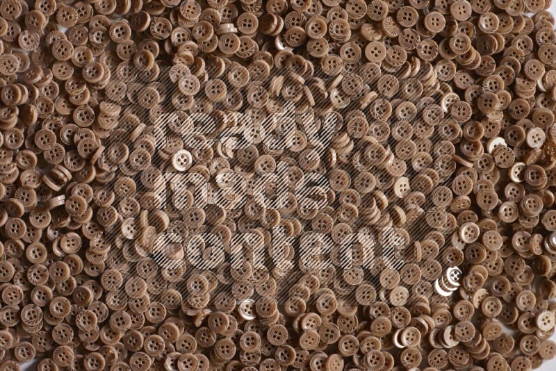 Brown buttons placed on grey background