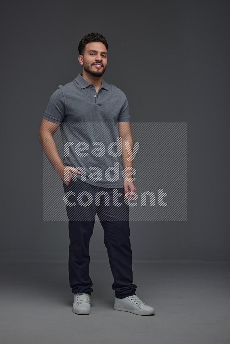 A man wearing casual making multi stand poses  eye level on a gray background