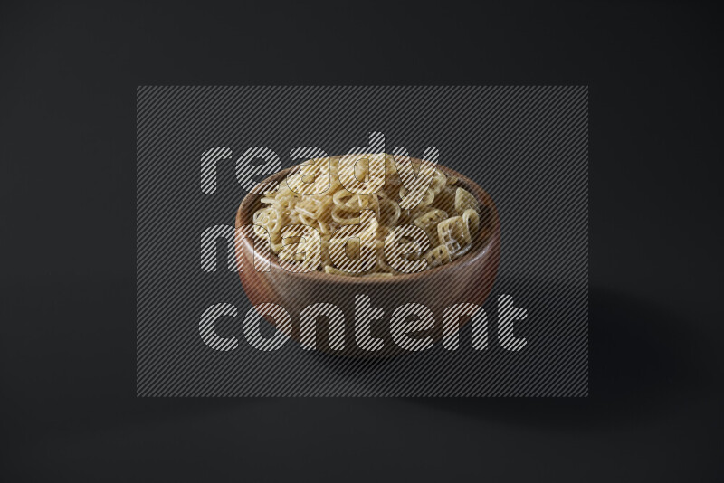 Snacks in a wooden bowl on grey background