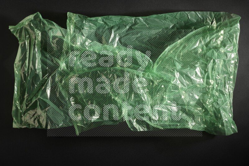 Colored plastic textures on black background