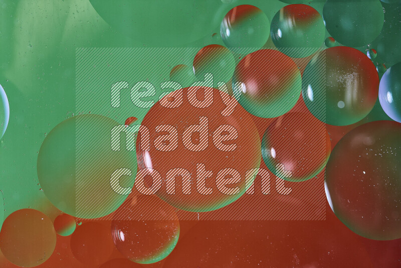 Close-ups of abstract oil bubbles on water surface in shades of green and red