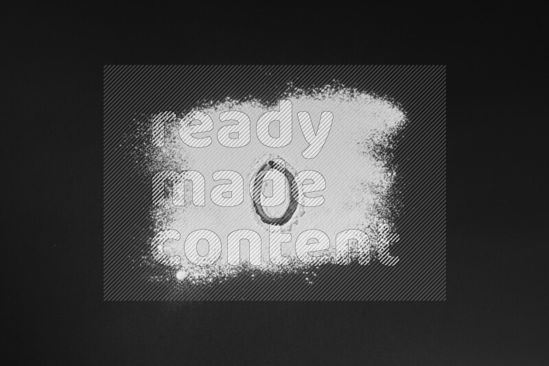 Numbers written with powder on black background