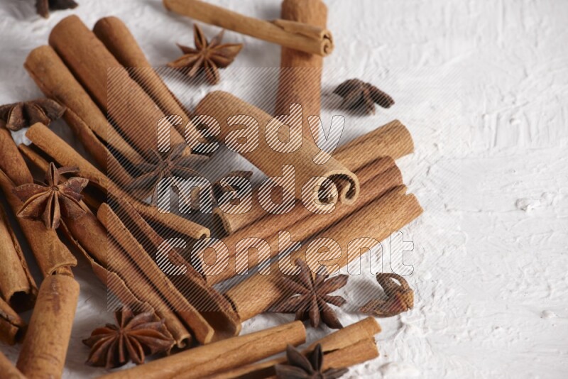 cinnamon sticks with star anise on white background