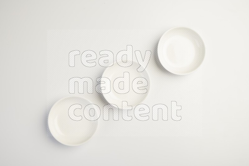 white ceramic round sauce dish on white countertop