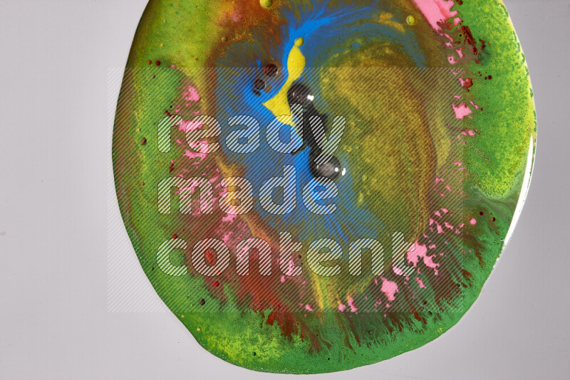 Close-ups of assorted colors blending on a grey background