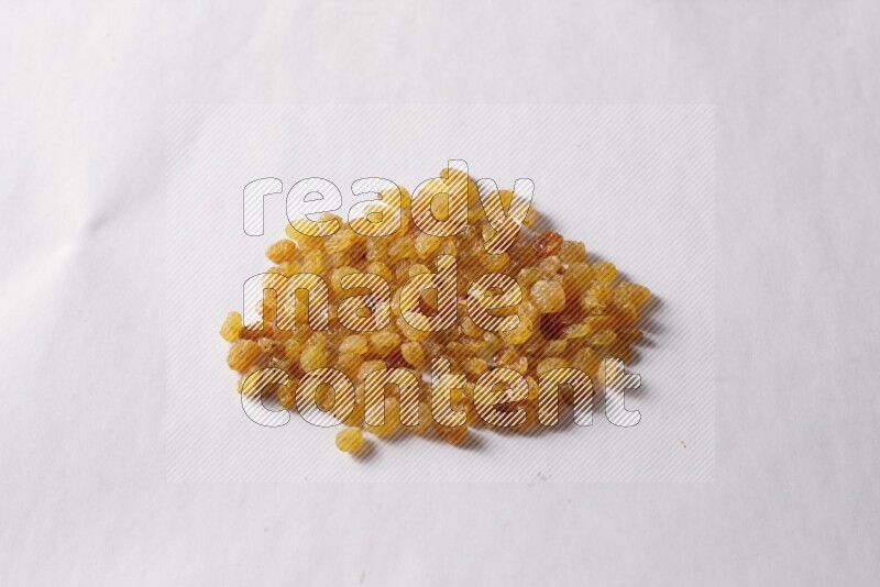 Raisins on white background