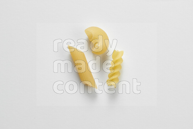 Different pasta types on white background