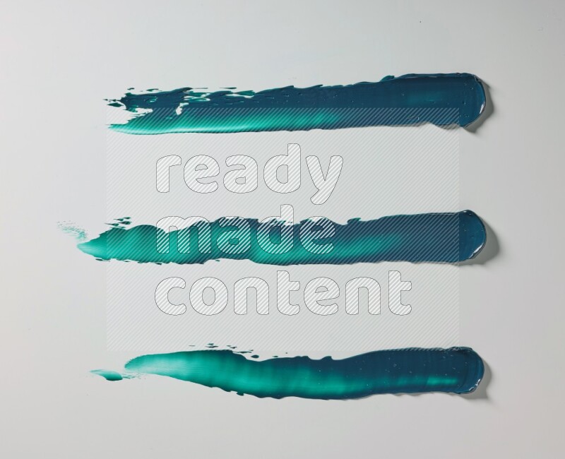 Turquoise painting knife strokes on white background