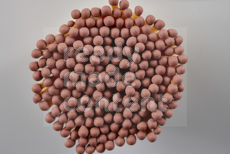 A close-up of a bundle of matches on grey background