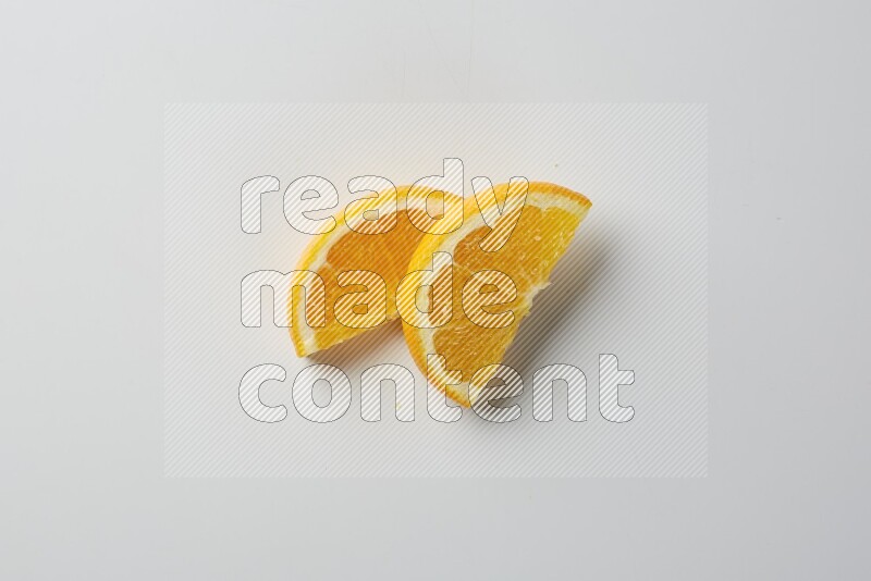 Two halves of an orange slices on white background