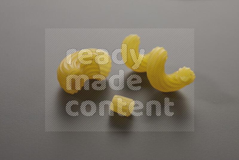 Different pasta types on grey background
