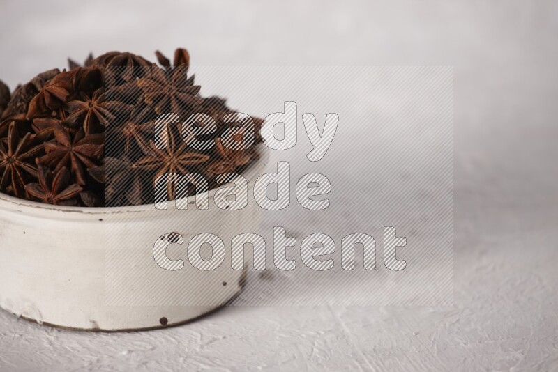 Star Anise in a white bowl on white background