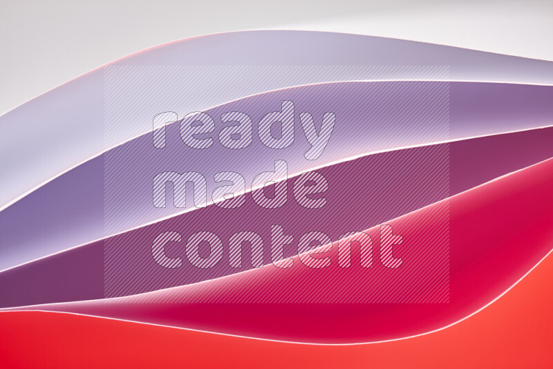 This image showcases an abstract paper art composition with paper curves in white and different warm gradients created by colored light