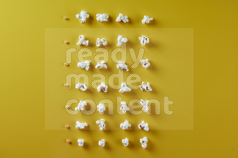 Popcorn flakes and seeds on a yellow background in different angles